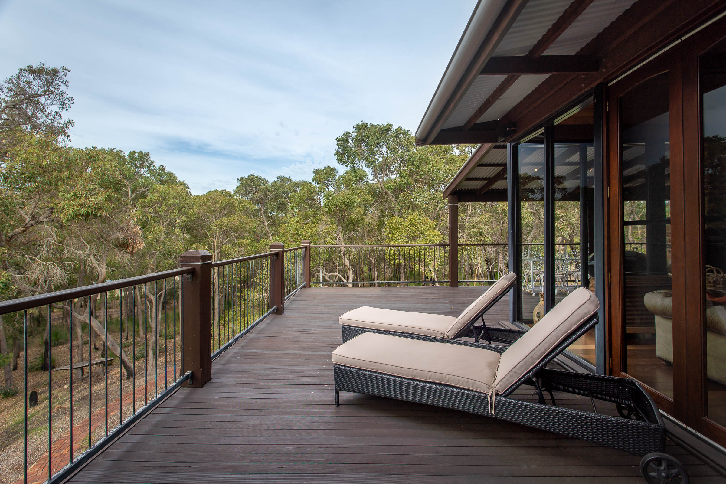 Sun lounges on the deck to enjoy the views